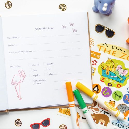 Kids prompted zoo journal shown with open page and props