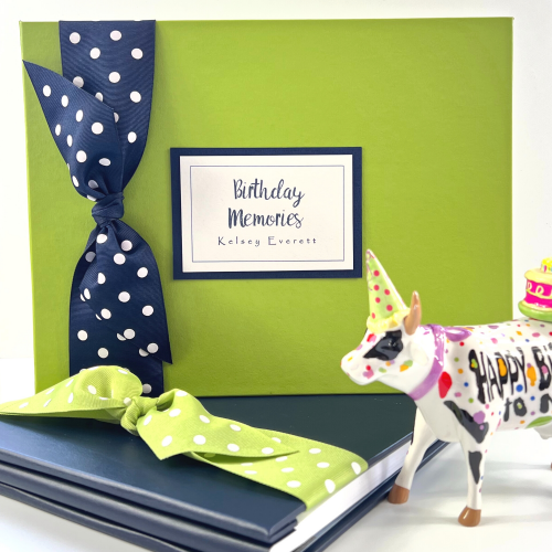 Kiwi cover birthday memories book with navy polka dot bow and birthday memories plaque