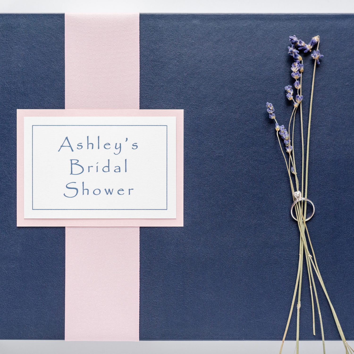 Wedding shower keepsake book in marine leather with pink ribbon and plaque