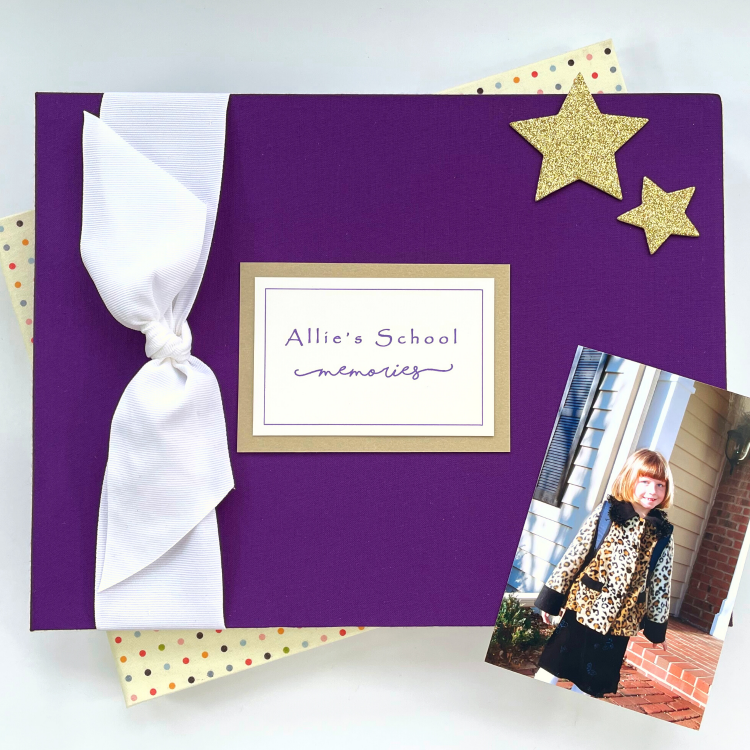 Grade School Memory book with purple cover, white grosgrain bow, name plaque and props