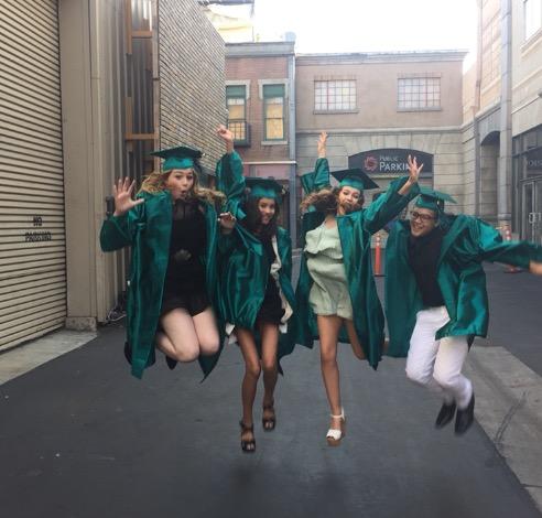 kids jumping for joy at middle school graduation