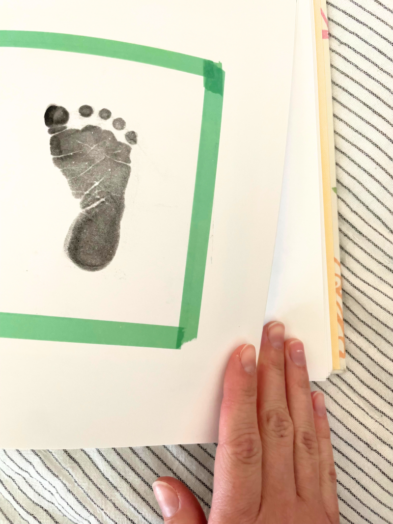 baby's first footprint on a baby memory book page